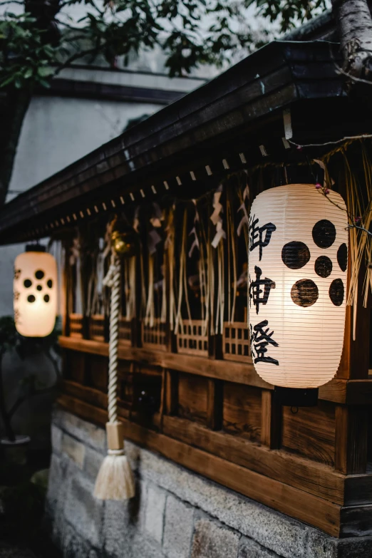 lanterns hanging from the side of a building, inspired by Kanō Shōsenin, trending on unsplash, ukiyo-e, light inside the hut, portrait photo, white, 8 1 5