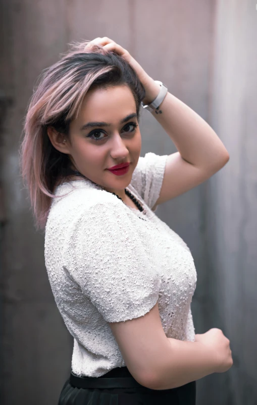 a woman in a white shirt and black skirt, inspired by Glòria Muñoz, pexels contest winner, indonesia, looking her shoulder, pastel faded effect, square