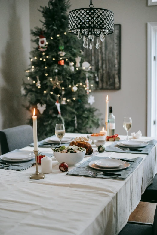 a dining room table with a christmas tree in the background, pexels contest winner, renaissance, grey, linen, full-body, thumbnail