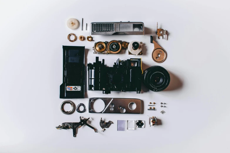 the contents of a camera laid out on a white surface, a picture, unsplash, assemblage, intricate machinery, inspect in inventory image, cut-away, medium format