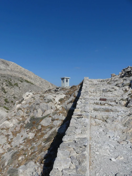 a set of stairs leading up to the top of a mountain, throne of olympus, split near the left, photo taken in 2018, standing atop a pile of rubble