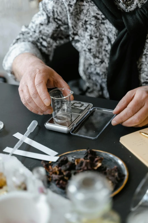 a woman sitting at a table with a plate of food, gelatine silver process, items and gadget, botanicals, extremely precise