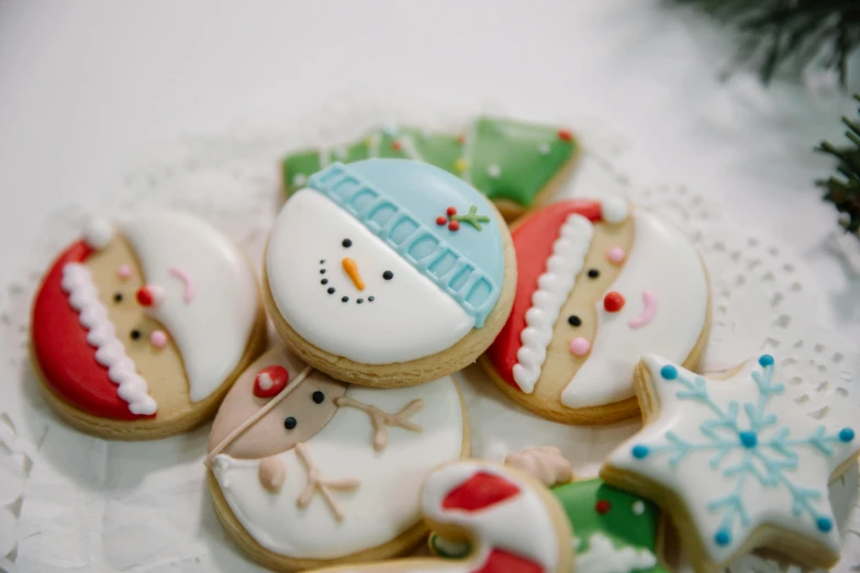 a plate of decorated christmas cookies on a table, a picture, by Emma Andijewska, pexels, cute face, frosty, 15081959 21121991 01012000 4k, thumbnail