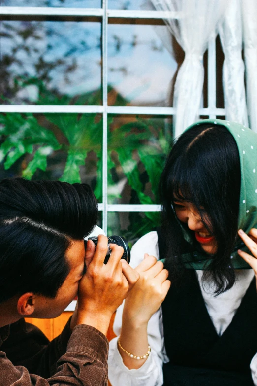 a man taking a picture of a woman with her cell phone, pexels contest winner, visual art, green and black hair, young cute wan asian face, covered in, flirting