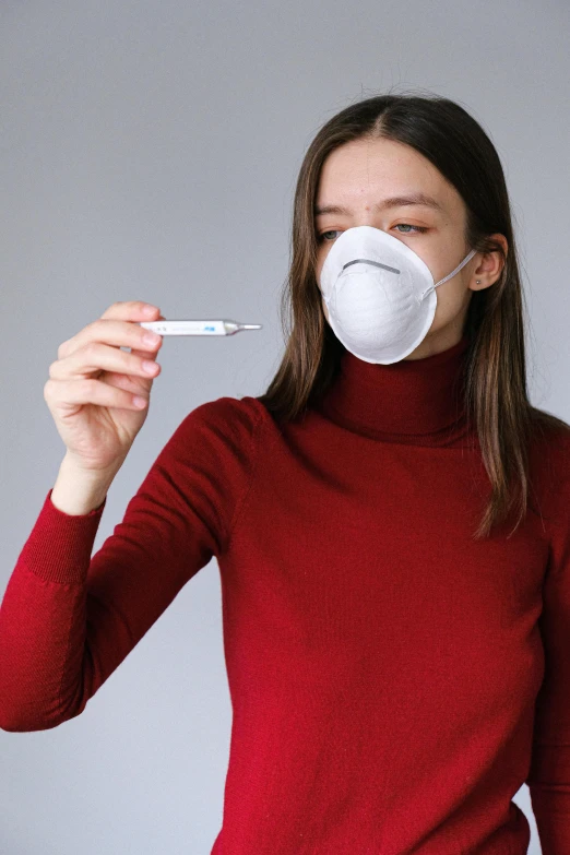 a woman wearing a face mask with a thermometer in her mouth, pexels, renaissance, wearing a red turtleneck sweater, maroon and white, syringe, promotional image