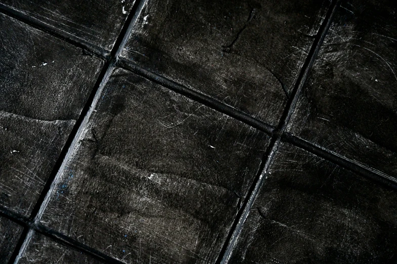 a red fire hydrant sitting on top of a tiled floor, an album cover, inspired by Pierre Soulages, unsplash, auto-destructive art, black textured, panel of black, detail texture, black chalk