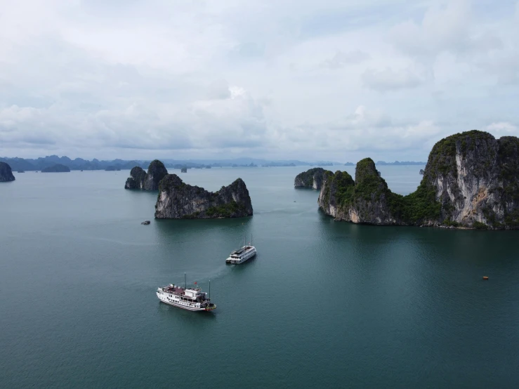 a couple of boats that are in the water, pexels contest winner, vietnam, rock arcs, fan favorite, aerial