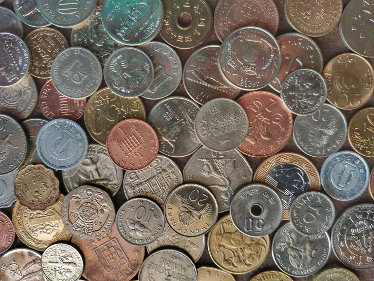 a pile of coins sitting on top of a table, hyperdetailed colourful, thumbnail, textured, many small details