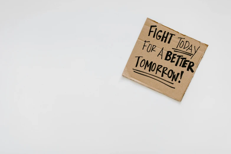 a sign that says fight today for a better tomorrow, cardboard, on a gray background, profile image, listing image