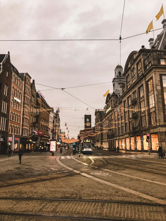 a city street filled with lots of tall buildings, a picture, by Jan Tengnagel, pexels contest winner, on a great neoclassical square, brown, dutch, city street cinematic lighting