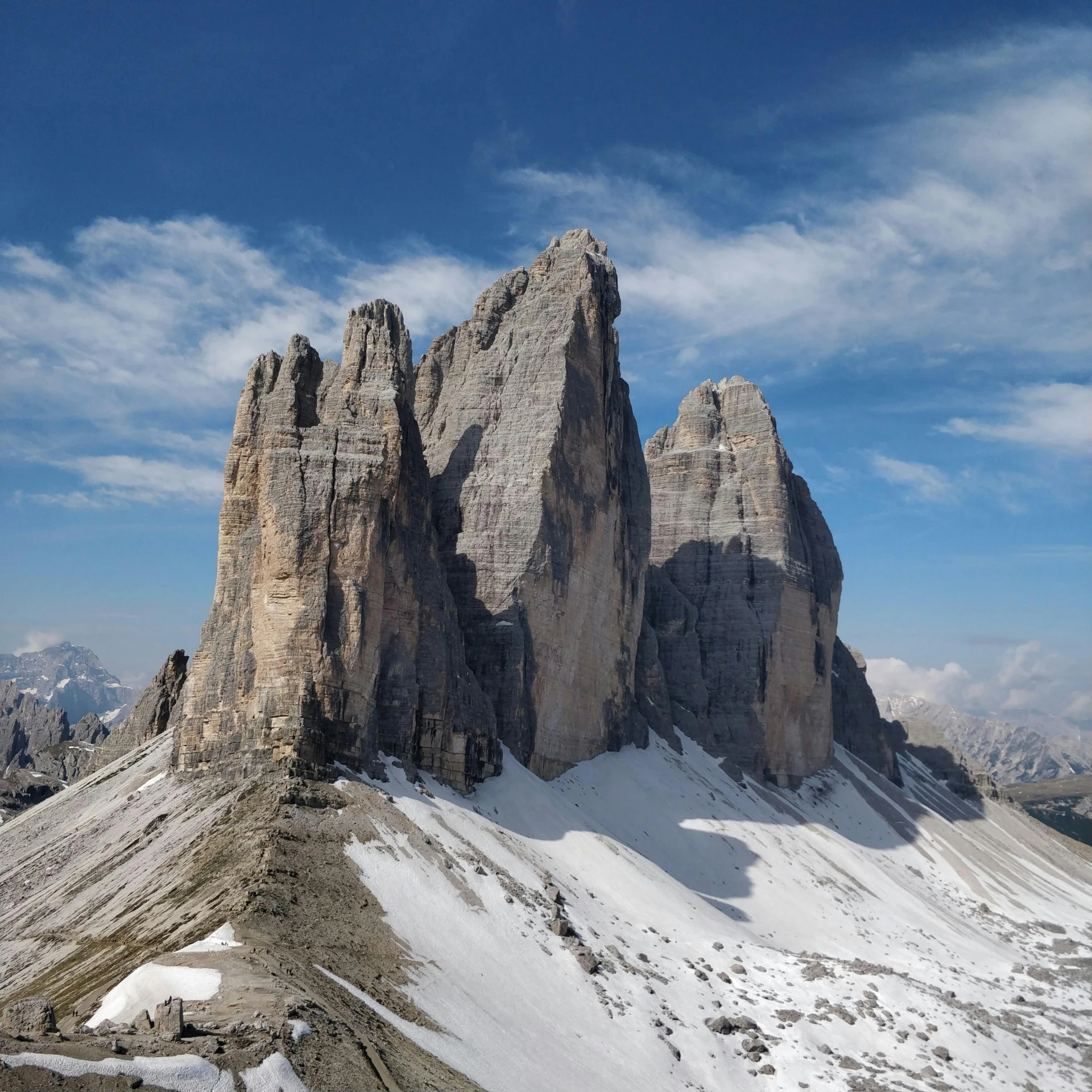 a group of people standing on top of a snow covered mountain, by Carlo Martini, pexels contest winner, les nabis, two giant towers, highly detailed rock structures, high angle vertical, seen from afar