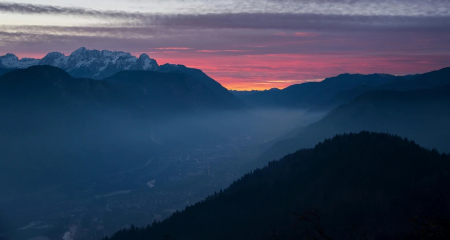 a view of the mountains from the top of a mountain, by Sebastian Spreng, pexels contest winner, romanticism, pink skies, chamonix, crepuscule, overlooking a valley with trees