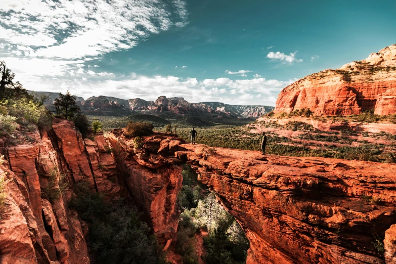 a view of a canyon from the top of a mountain, by Lee Loughridge, pexels contest winner, art nouveau, red sand, towering over your view, panoramic, high quality product image”