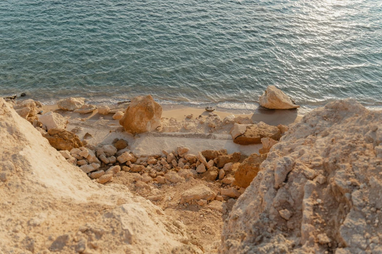 a number of rocks near a body of water, pexels contest winner, les nabis, red sea, mini amphitheatre, photo from the dig site, high angle shot