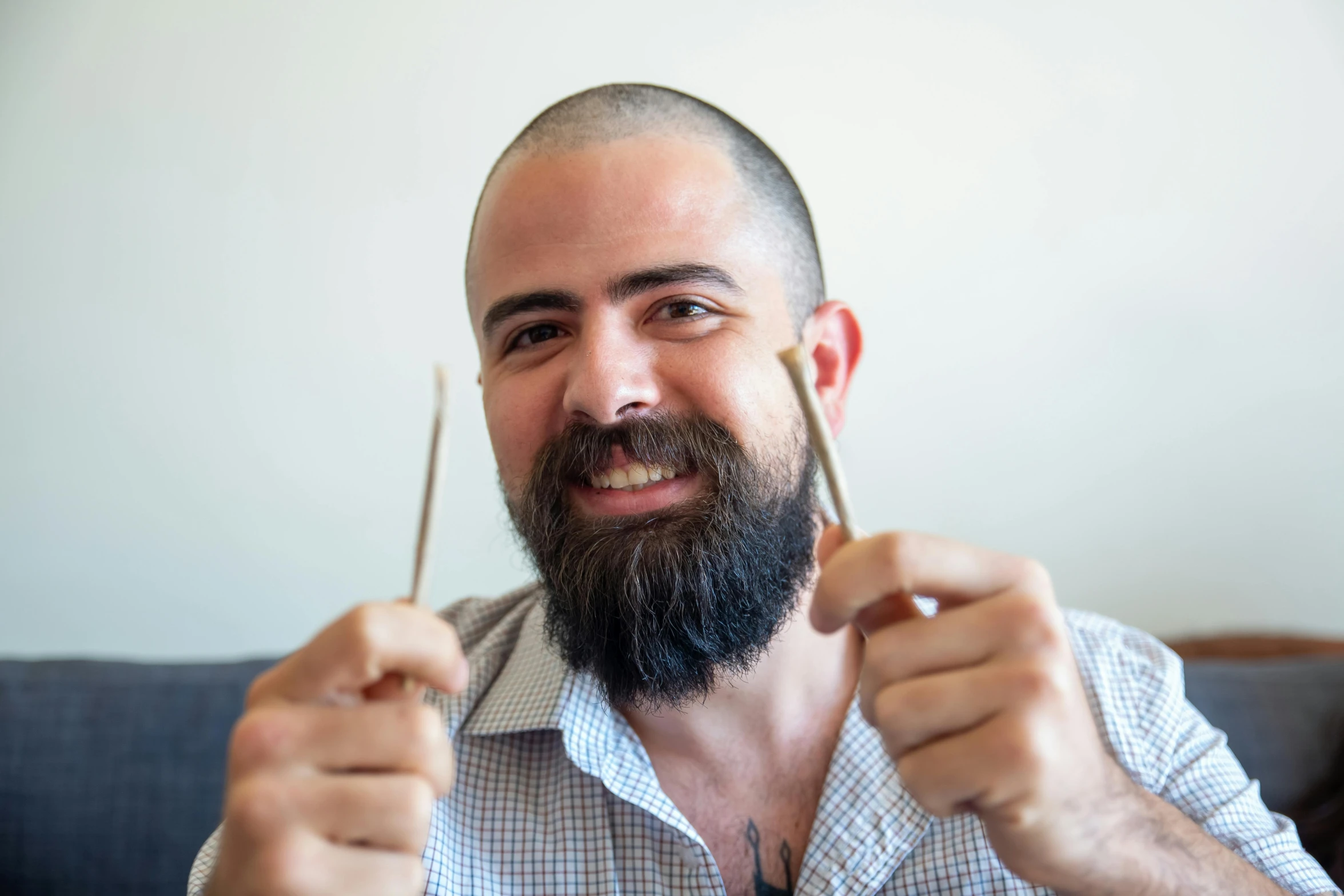 a man with a beard holding a pair of scissors, featured on reddit, hurufiyya, drummer, headshot profile picture, holding a wooden staff, profile image