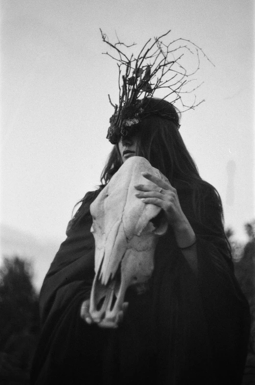 a black and white photo of a woman with a goat's skull, by Kati Horna, unsplash, ffffound, female druid, faceless, female earth mage