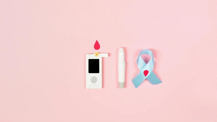 an electronic device with a blue ribbon next to it, a picture, by Évariste Vital Luminais, some pink, awareness, tear, products shot