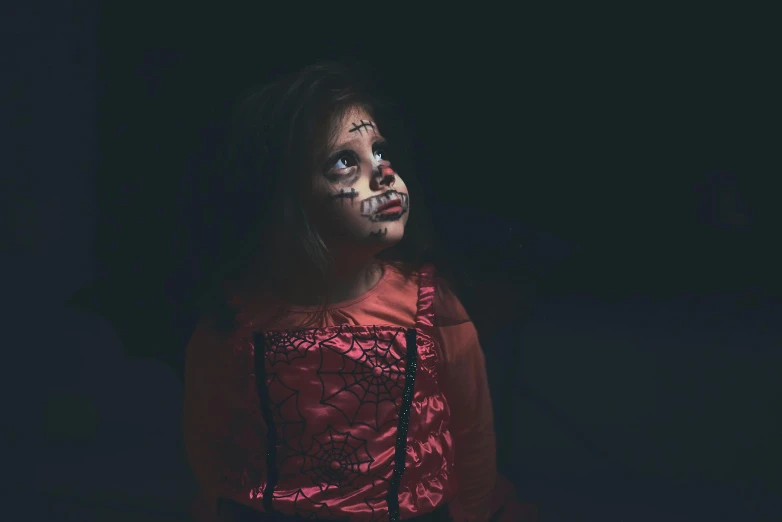 a woman with makeup on her face in the dark, inspired by Gottfried Helnwein, pexels, lowbrow, cute little girl, wearing a fancy dress, dead child, the'other mother'from'coraline '