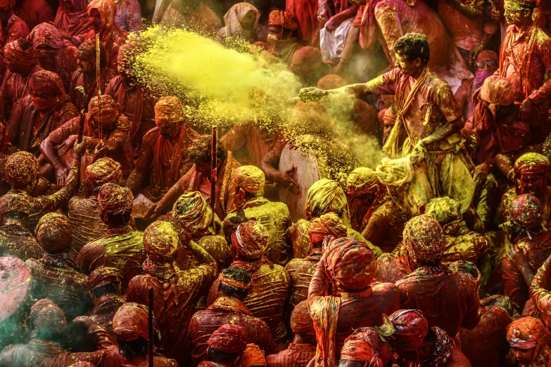 a crowd of people covered in colored powder, a colorized photo, inspired by Steve McCurry, pexels contest winner, indian temple, yellow and red, 🎨🖌️, intricate detailed 8 k