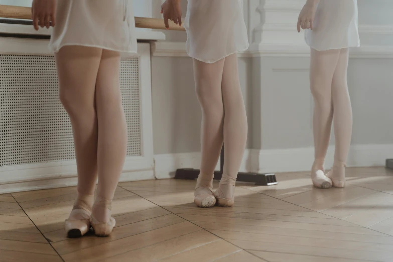a group of women standing in front of a mirror, an album cover, by Emma Andijewska, trending on unsplash, arabesque, white tights, 15081959 21121991 01012000 4k, school class, silver，ivory