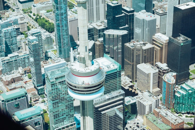 an aerial view of a city with tall buildings, by Nicolette Macnamara, pexels contest winner, hurufiyya, cn tower, cool skydome, foster and partners, closeup - view