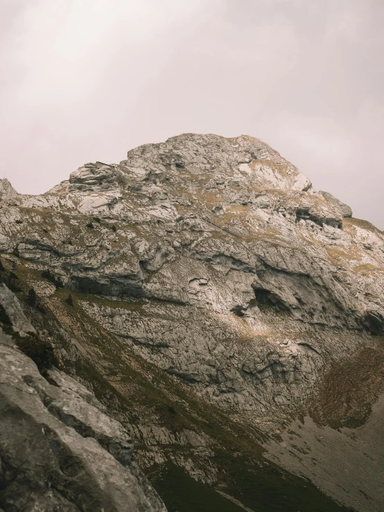 a couple of people standing on top of a mountain, by Adam Szentpétery, les nabis, high detail photograph, high quality image, limestone, seen from a distance