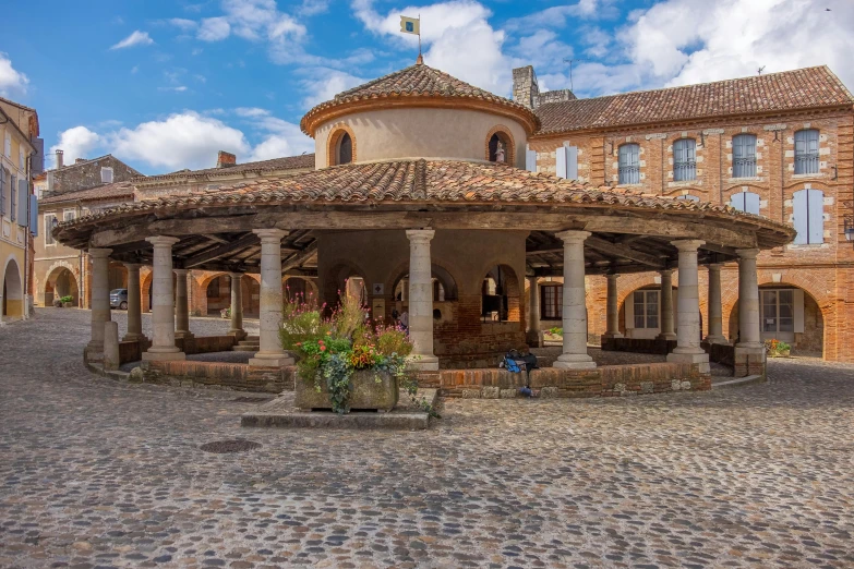 a large building sitting on top of a cobblestone street, a mosaic, inspired by Jean Colombe, pexels contest winner, romanesque, gazebos, st cirq lapopie, panorama, square