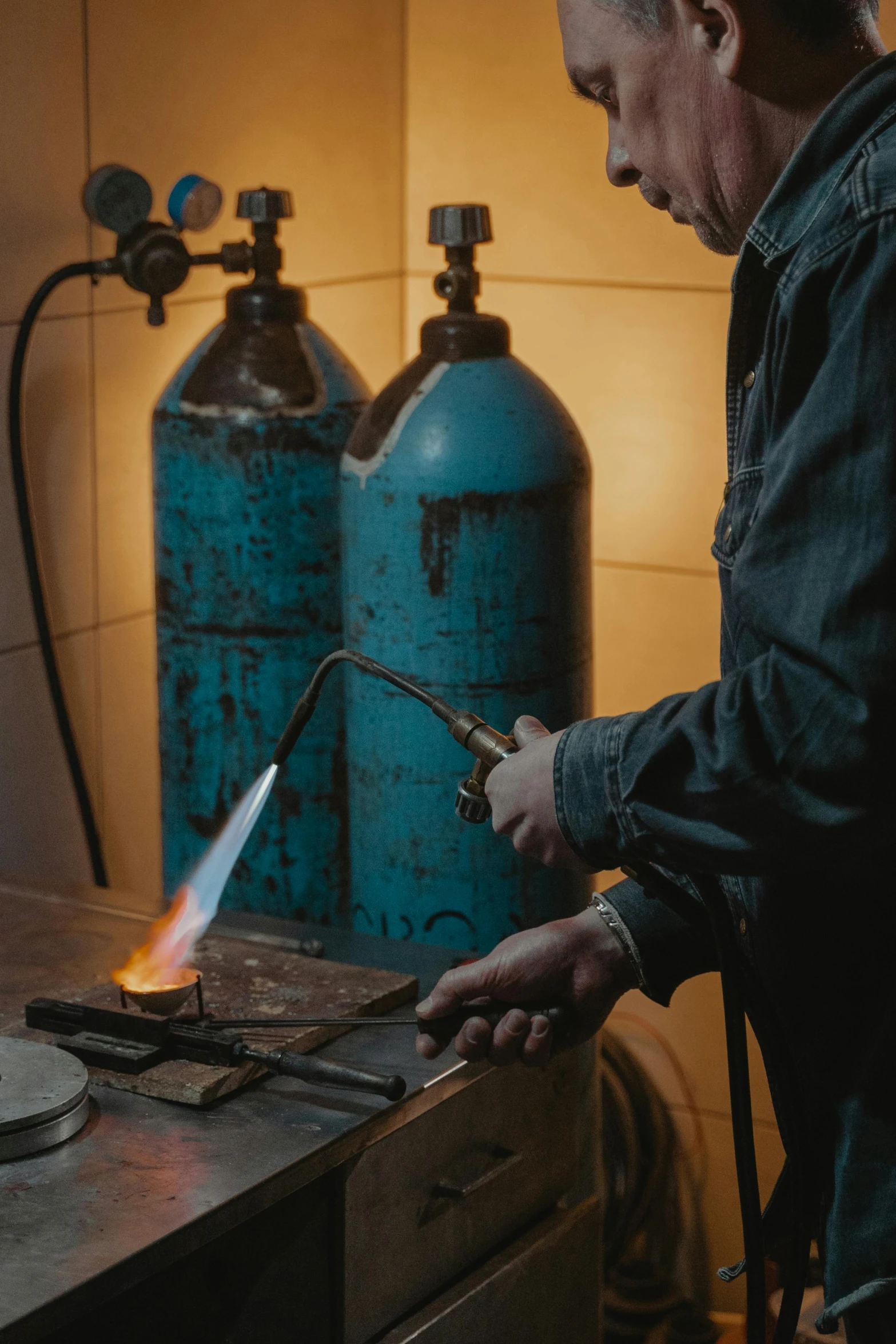 a man that is standing in front of a stove, welding torches for arms, copper oxide and rust materials, thumbnail, petrol aesthetic