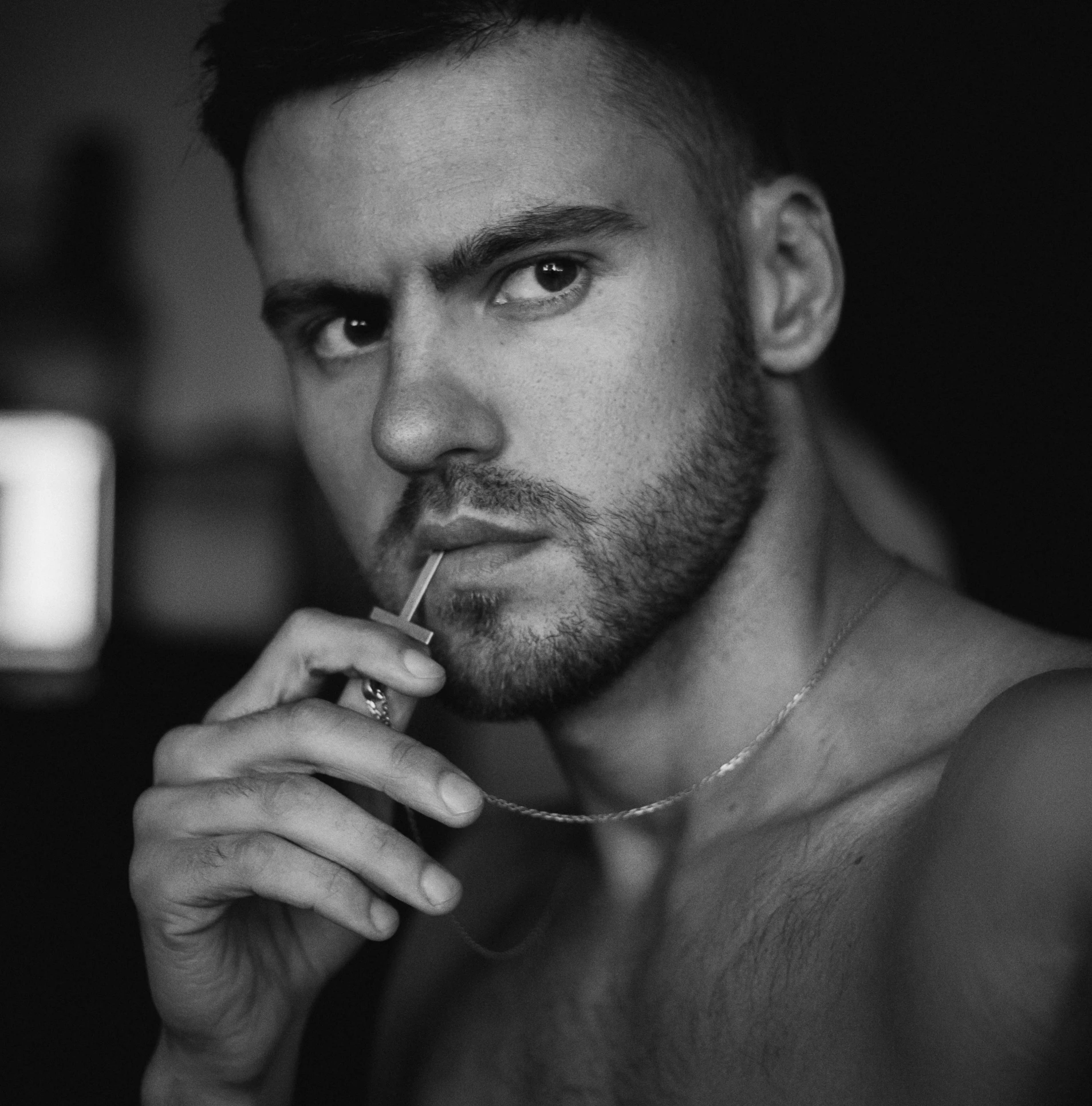 a shirtless man with a cigarette in his mouth, by Adam Marczyński, pexels contest winner, adriana chechik, square masculine jaw, cute young man, intense line work