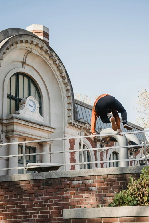 a man flying through the air while riding a skateboard, by Nina Hamnett, unsplash, arabesque, in balcony of palace, bending over, exterior botanical garden, train station