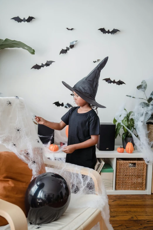 a little boy dressed up as a witch for halloween, pexels contest winner, decoration around the room, thumbnail, inspect in inventory image, medium shot of two characters