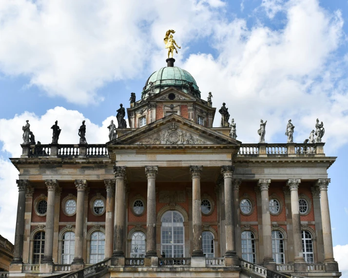 a large building with statues on top of it, inspired by Hubert Robert, pexels contest winner, lower saxony, castelvania, profile image, front