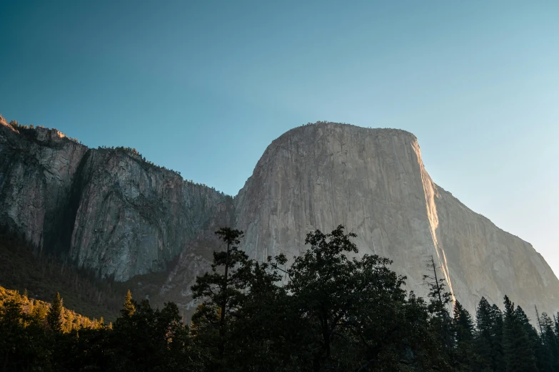 a mountain in the distance with trees in the foreground, unsplash contest winner, el capitan, morning light showing injuries, slide show, album
