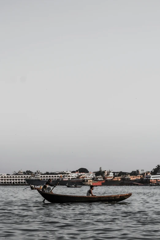 a small boat in the middle of a body of water, by Sunil Das, happening, surrounding the city, grey, ::