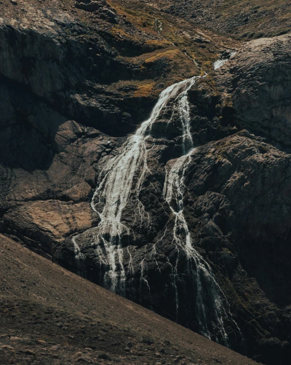 a horse standing in front of a waterfall, an album cover, pexels contest winner, hurufiyya, geology, thumbnail, telephoto shot, small waterfall