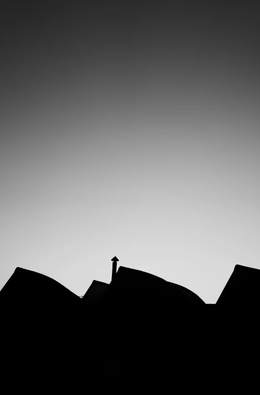 a black and white photo of a person standing on top of a roof, by Matthias Weischer, minimalism, [ shards, silhouette!!!, san francisco, house on a hill