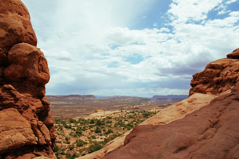 a large rock formation in the middle of a desert, by Lee Loughridge, unsplash contest winner, moab, panoramic view, shot from roofline, background image