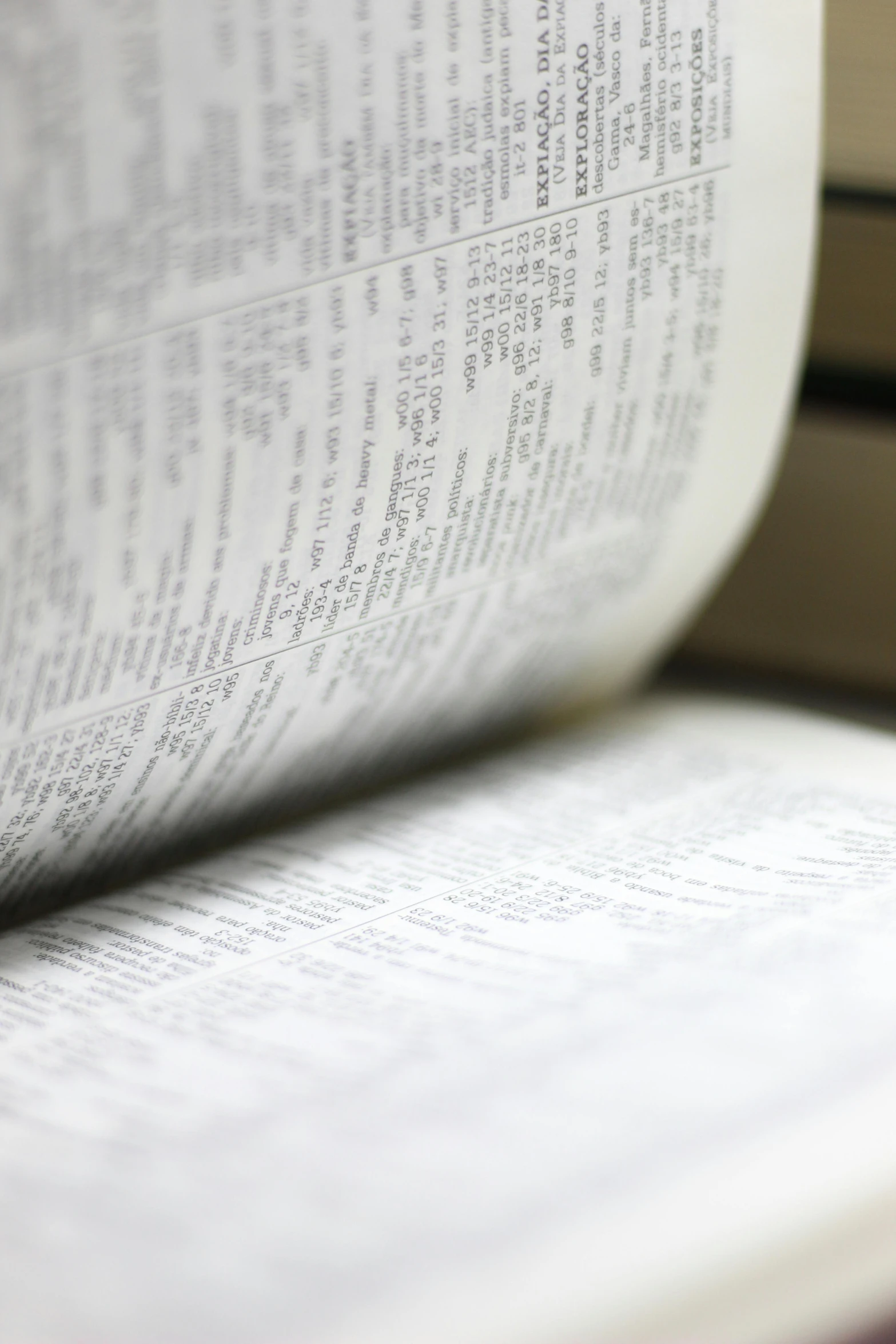 a stack of books sitting on top of a table, legible text, upclose, intricately defined, bible