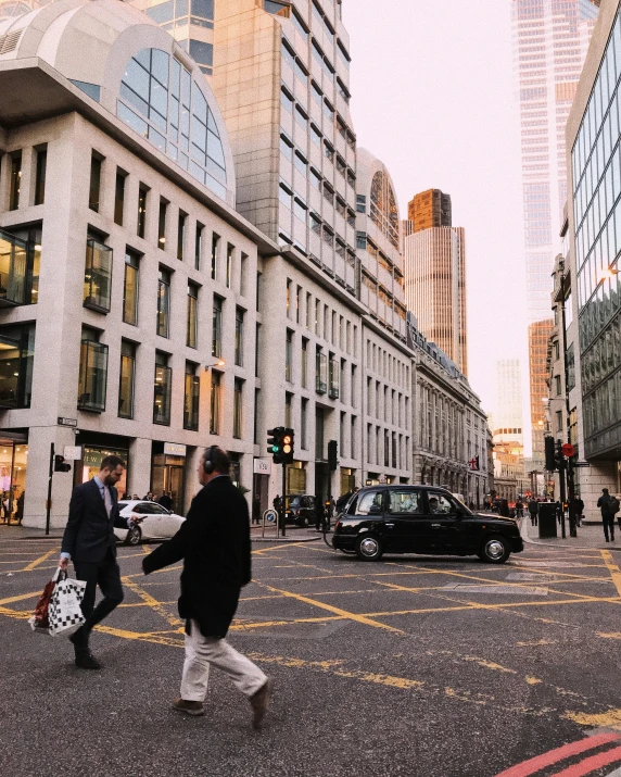 a couple of people walking across a street, by Adam Rex, pexels contest winner, modernism, london architecture, lgbtq, norman foster, vogue cover photo