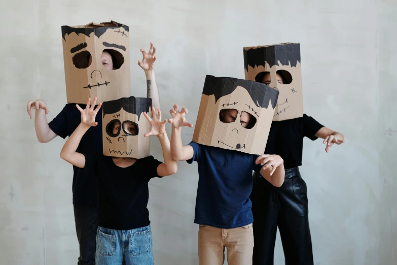 a group of people standing next to each other with boxes on their heads, pexels contest winner, visual art, boy with neutral face, made of cardboard, black eyed kids, promotional image