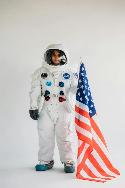 a man in an astronaut suit holding an american flag, pexels contest winner, renaissance, photo of a black woman, white background, crypto, technical suit