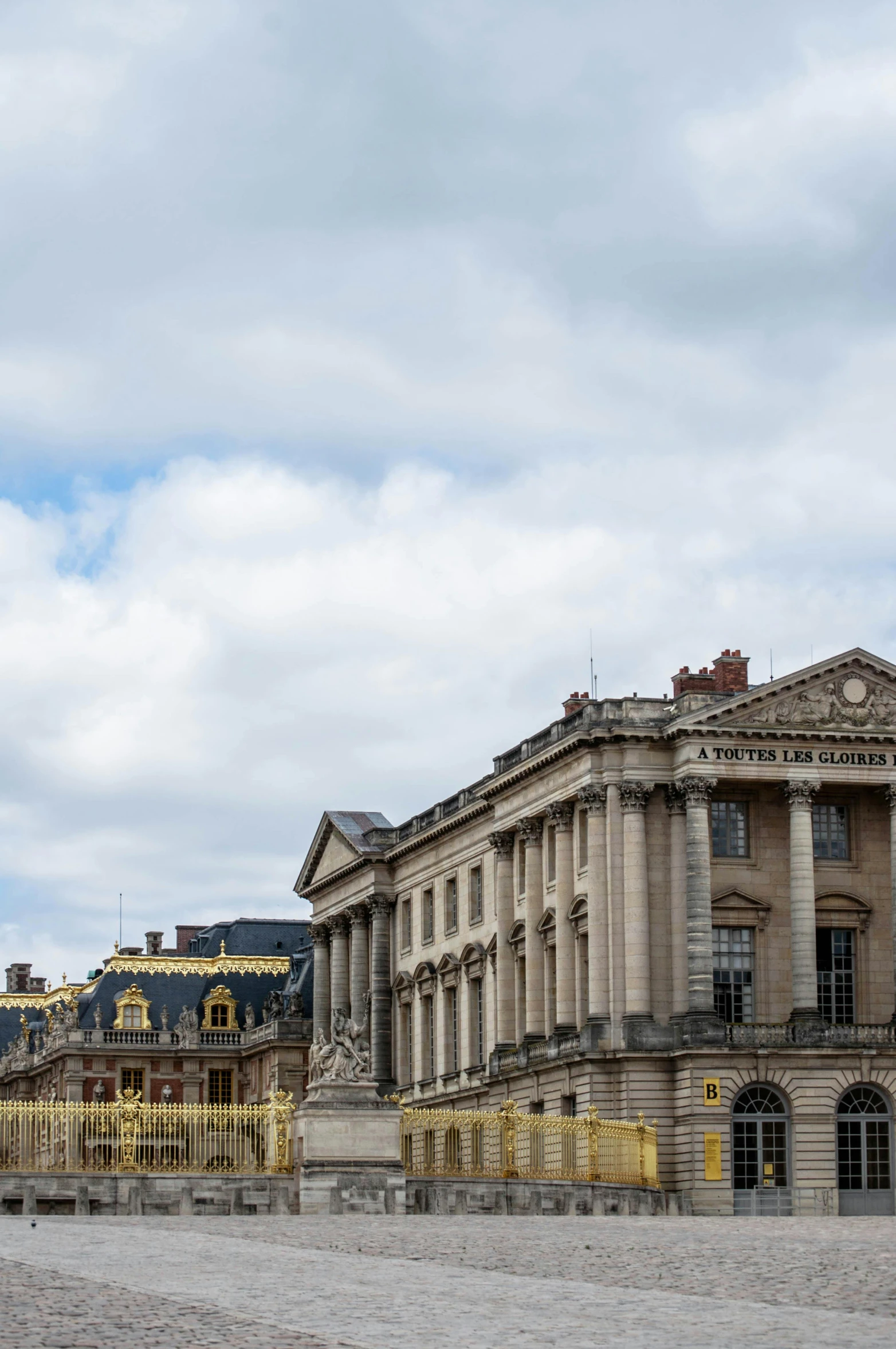 a large building sitting on top of a cobblestone street, inspired by François Girardon, neoclassicism, palace of versailles, 2019 trending photo, 2 5 6 x 2 5 6 pixels, hull