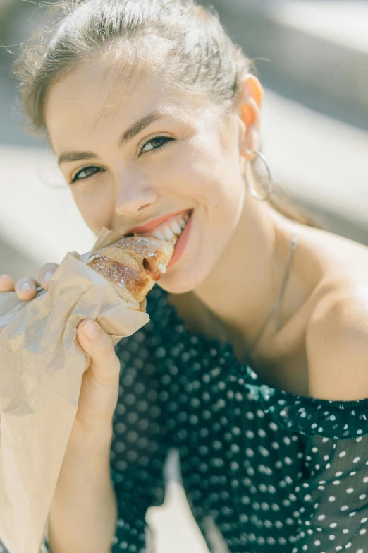 a woman is eating a piece of pizza, pexels contest winner, portrait of barbara palvin, pulled pork sandwich, sunny day, ribs