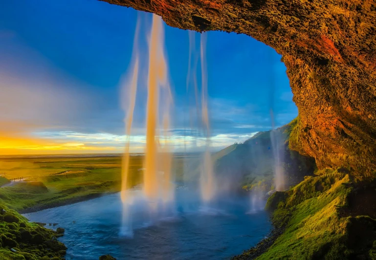 a waterfall coming out of the side of a cliff, pexels contest winner, romanticism, fountains and arches, hard morning light, youtube thumbnail, iceland hills in the background