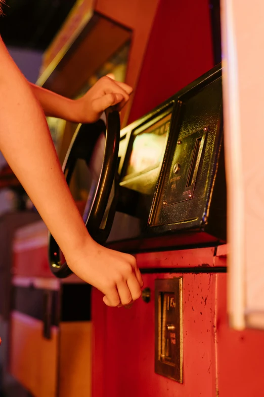 a close up of a person playing a video game, arcade game, cruise control, during the night, blank