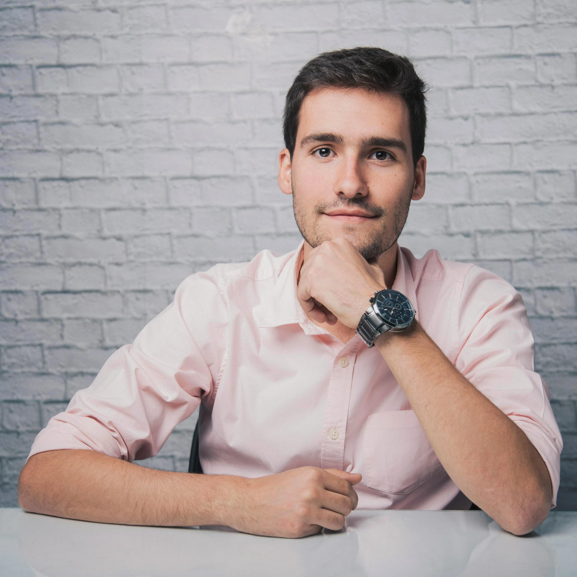 a man sitting at a table with a watch on his wrist, a picture, avatar image, anton fadeev 8 k, lovingly looking at camera, professional profile photo