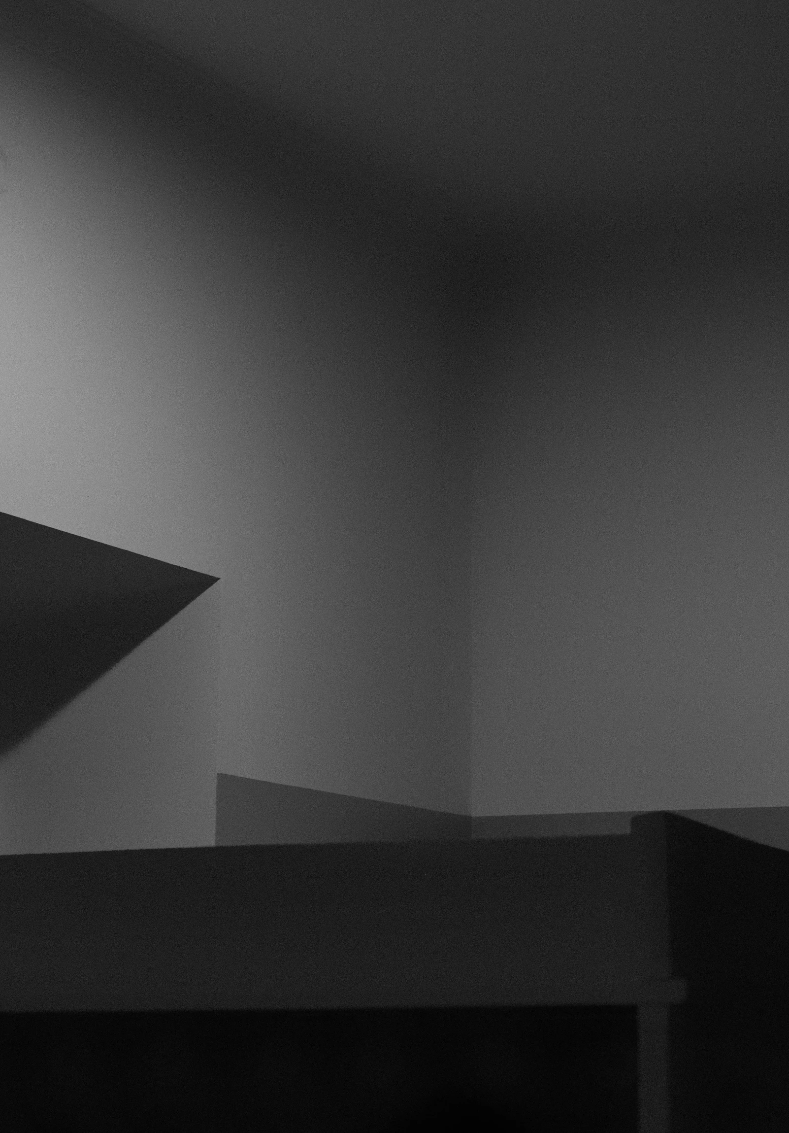 a black and white photo of a corner of a room, trending on polycount, conceptual art, (abstract), courtesy of moma, modeled lighting, promo image