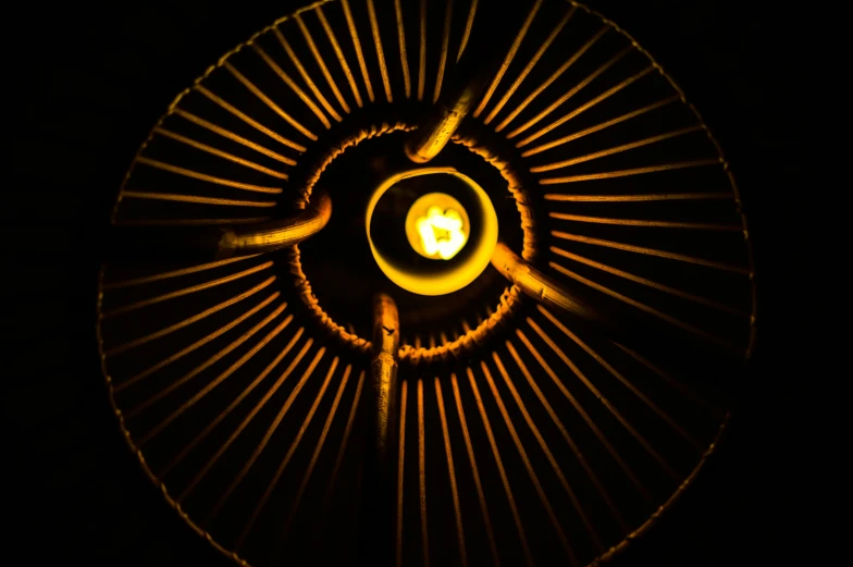 a close up of a lit candle in a dark room, pexels contest winner, nuclear art, orange halo, woven with electricity, gong, top down extraterrestial view