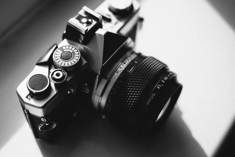 a black and white photo of a camera, by Karl Buesgen, unsplash, 4 5 mm. photorealistic, medium format, cute photograph, canon a1