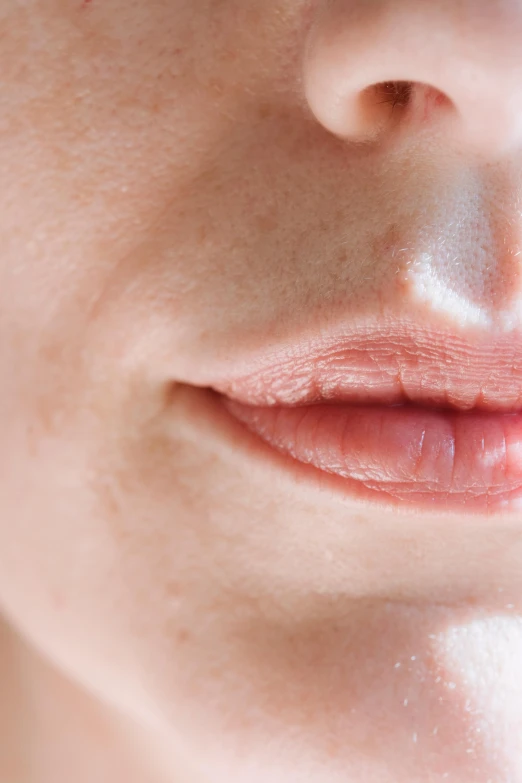 a close up of a person with a tooth brush in their mouth, by Sven Erixson, reddit, hyperrealism, jimin\'s plump lips, soft portrait shot 8 k, visible veins, beauty mark on cheek